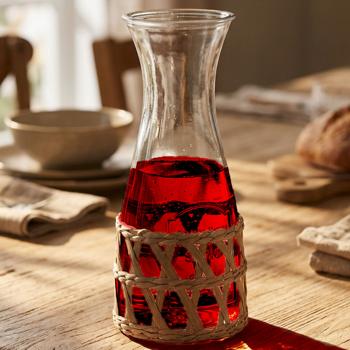 Preview: Glass carafe 1200 ml with rattan – stylish water carafe for refreshments – elegant glass carafe with natural rattan weave – perfect gift