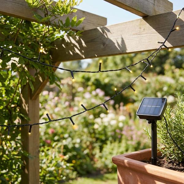 Solar string lights with 100 warm white LEDs for outdoor use: 12.5 m total length, automatic dusk sensor, ideal for garden, balcony & terrace