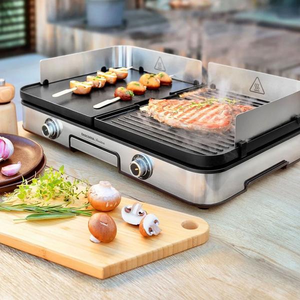 Electric barbecue grill with 2 separate grilling zones, reversible grill plates, stainless-steel wind guard & drip tray, 2-zone table grill